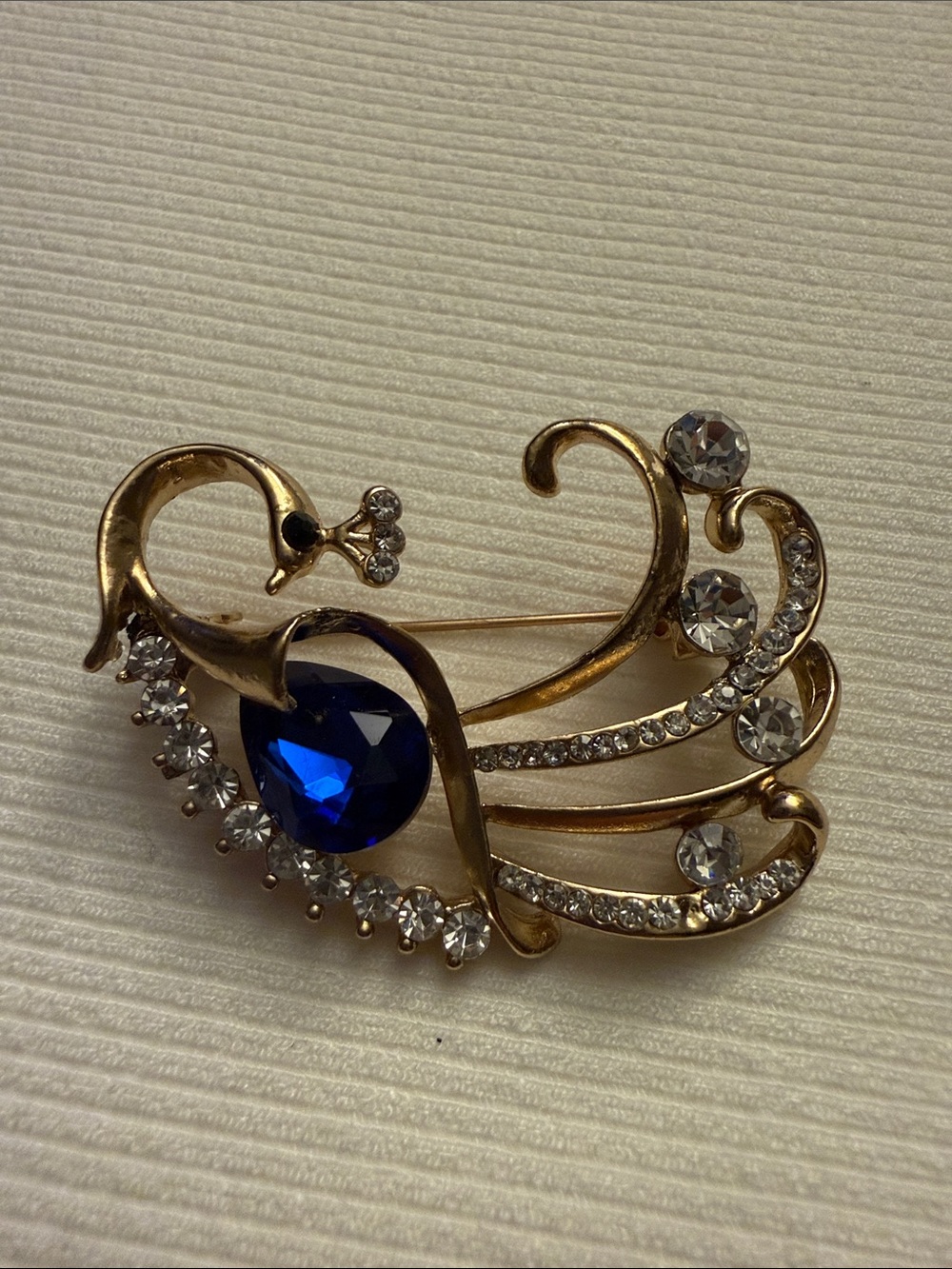 Gold-Tone Swan Brooch with Deep Blue Teardrop Crystal